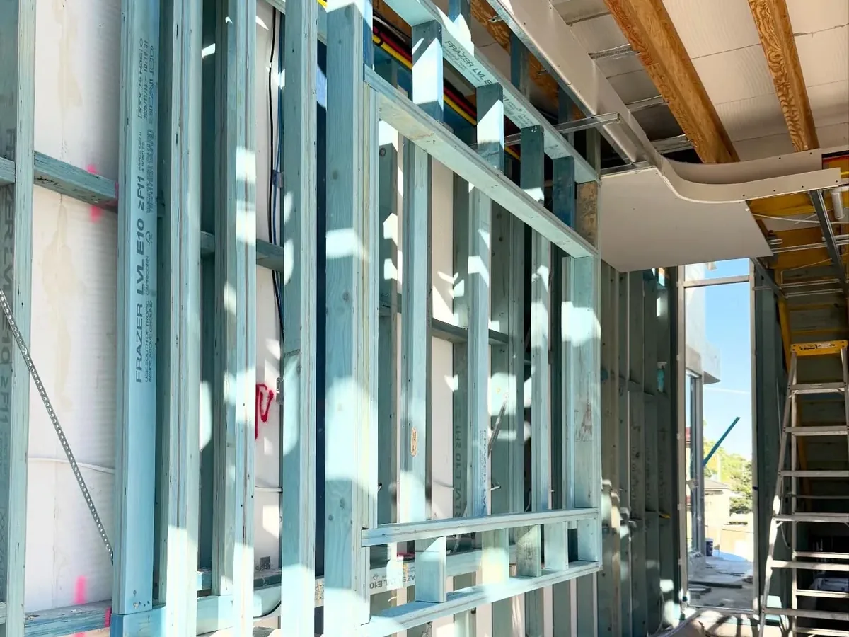 Curved bulkhead and custom wall framing detail inside a Sydney build by Jirah Carpentry