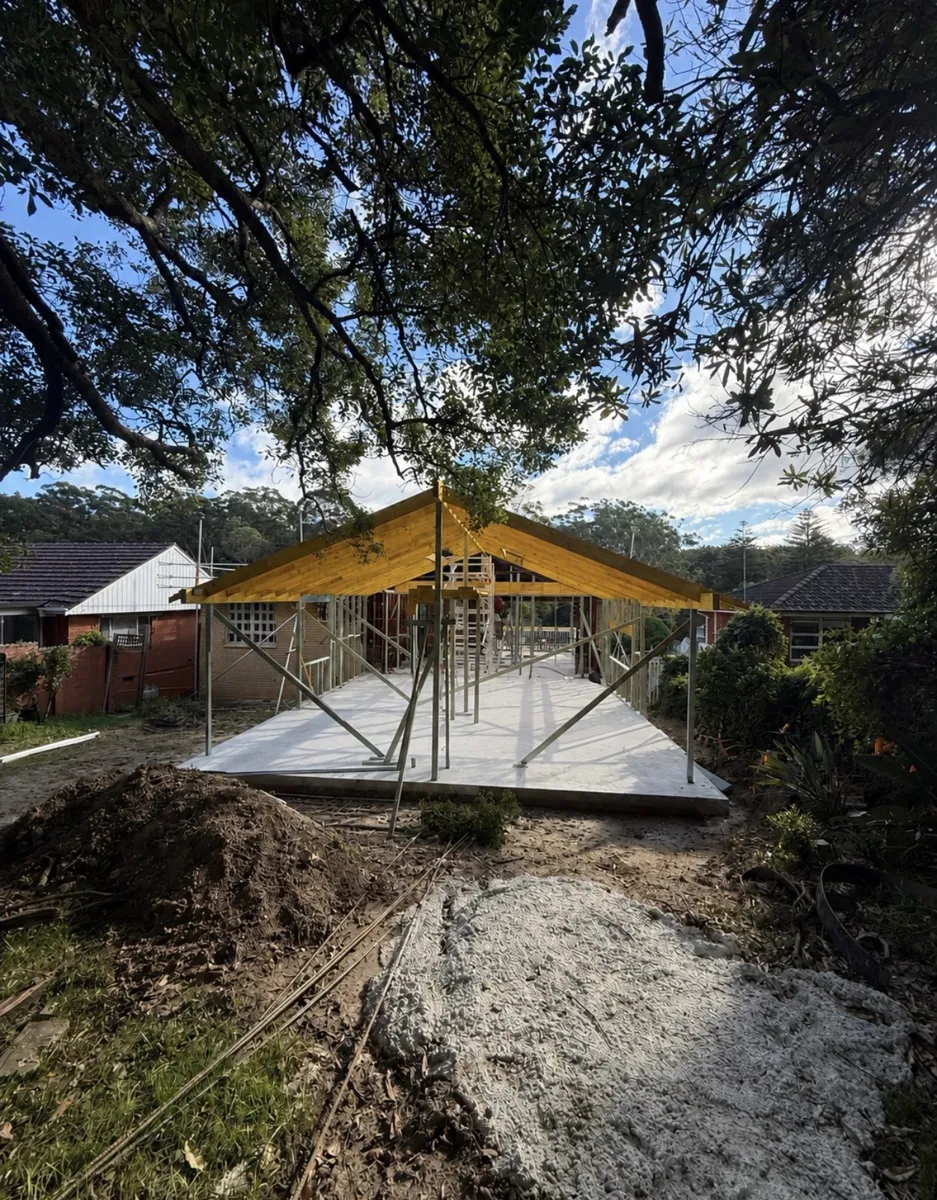 Timber roof frame and steel props on a rear home extension slab in Sydney by Jirah Carpentry