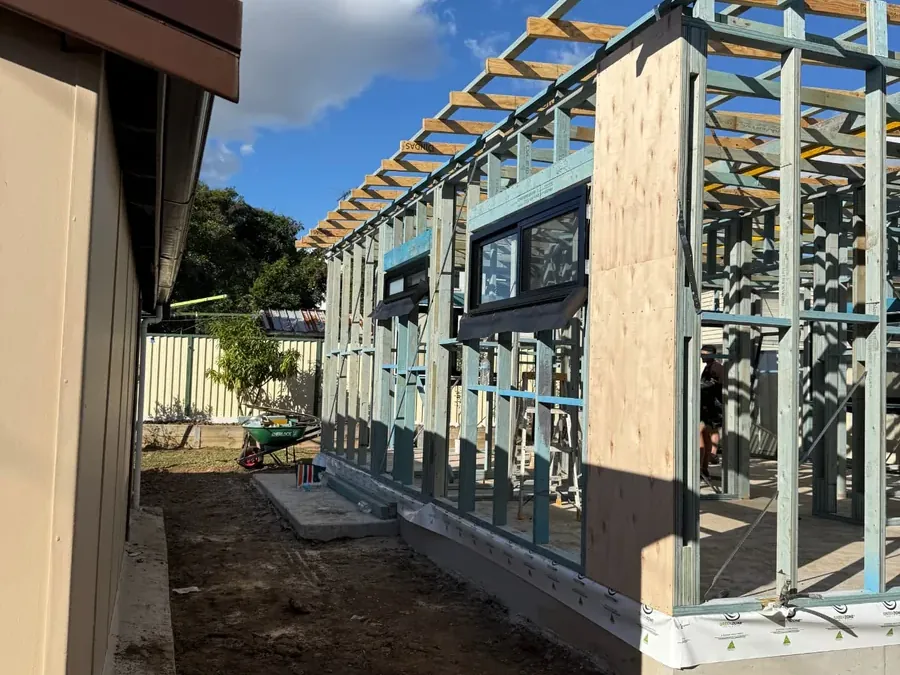 Granny flat wall and roof framing beside an existing home in Sydney by Jirah Carpentry
