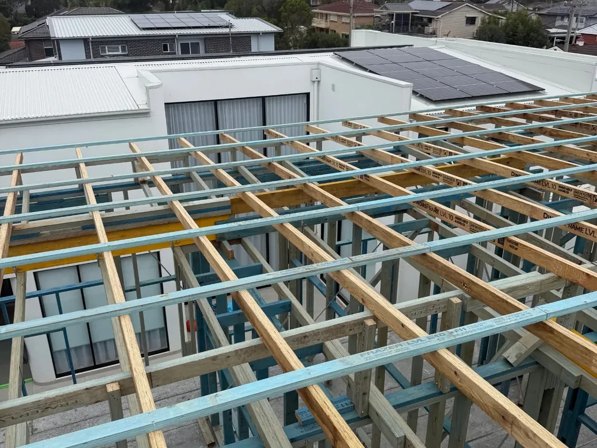 Upper floor LVL joists and wall frames on a Sydney new build, viewed from roof level, by Jirah Carpentry