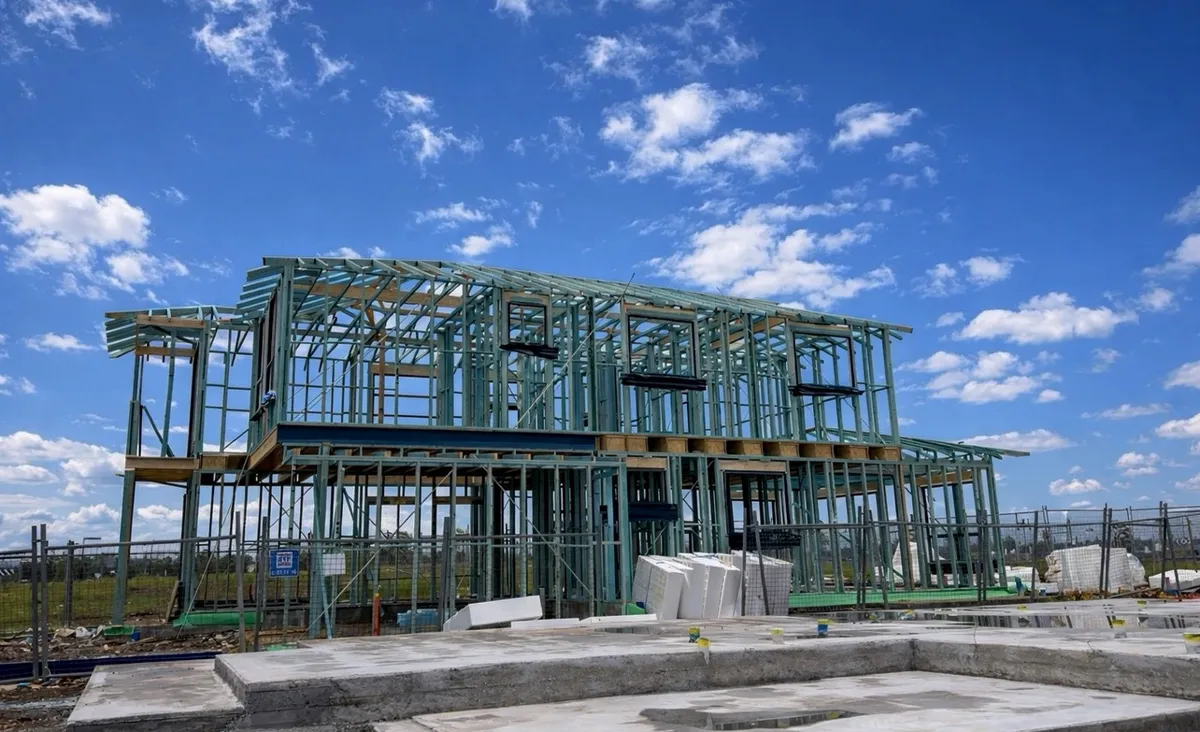 Two-storey new home frame complete to roof level on a Sydney estate by Jirah Carpentry